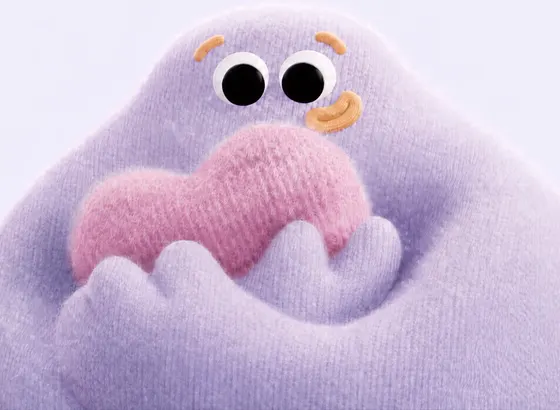 The lavender guardian hugging a pink knitted heart.